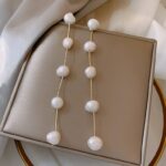 brinco de perolas naturais longo fino ddaa