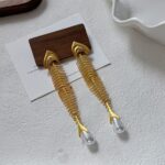 maxi brinco dourado longo com pérola espinha peixde