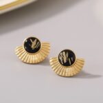 Brinco de pressao preto e dourado moderno de meio so ffdfssfdl