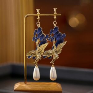 Brinco de pressão azul e dourado grande oriental de pássaro 